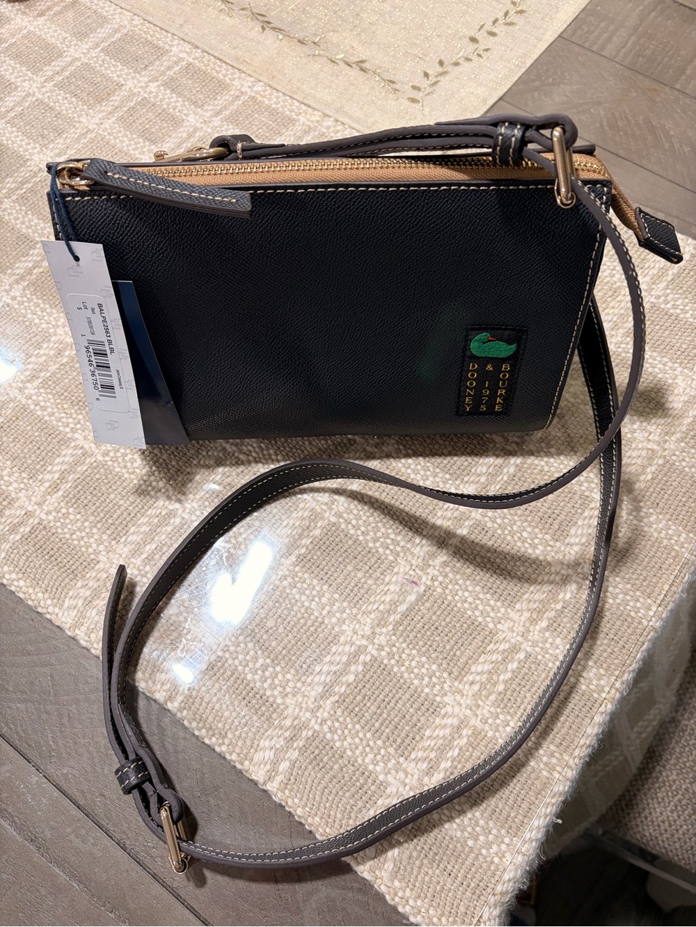Dooney & Bourke Black Crossbody with Tan Trim and Green Logo Accent